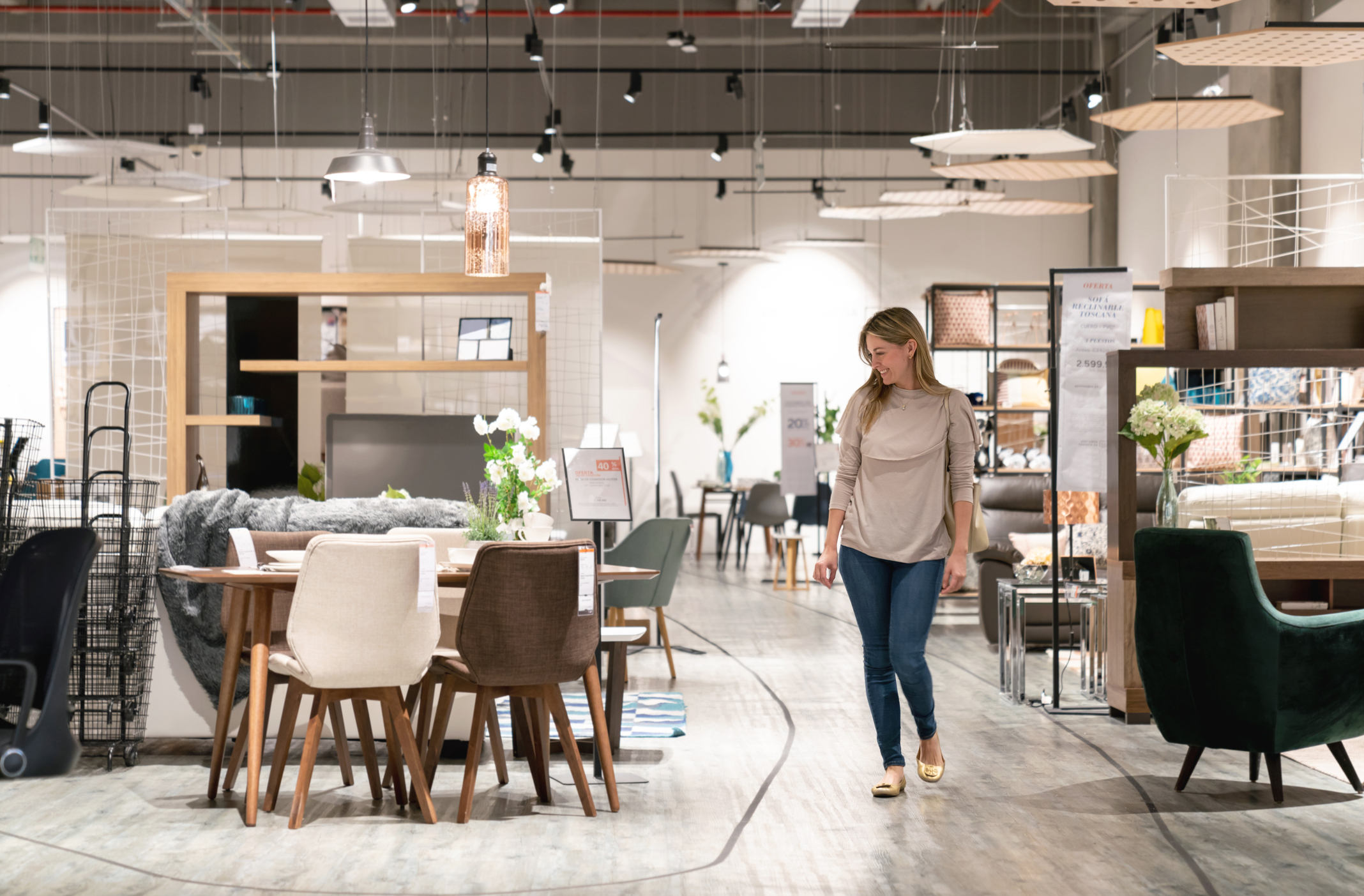 Happy woman shopping at a furniture store