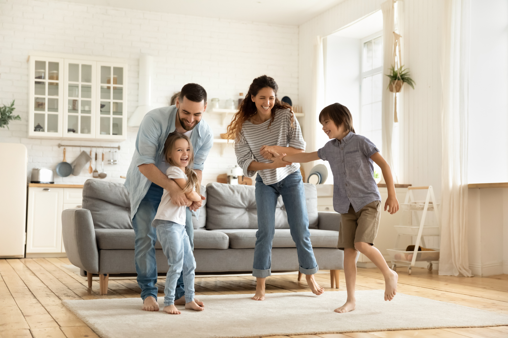 Happy family playing funny game having fun together.